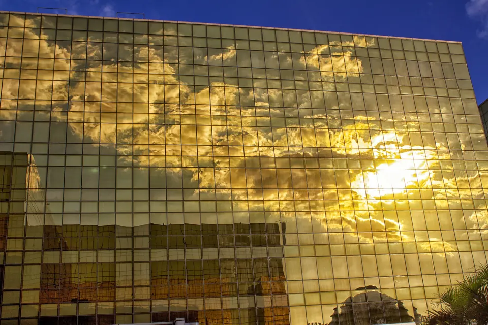 Golden City of Dreams Manila hotel facade reflecting the sunset