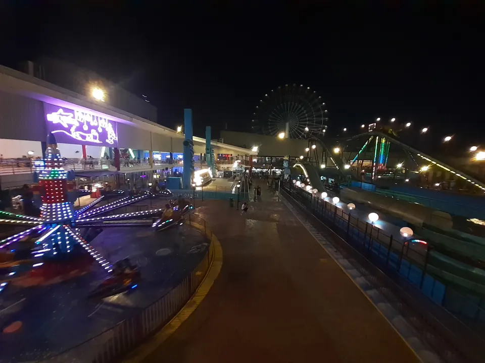 Star City amusement park rides illuminated at night